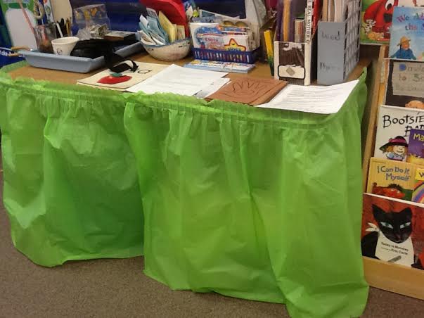 Cover chaos with a table skirt to keep your classroom looking tidy.